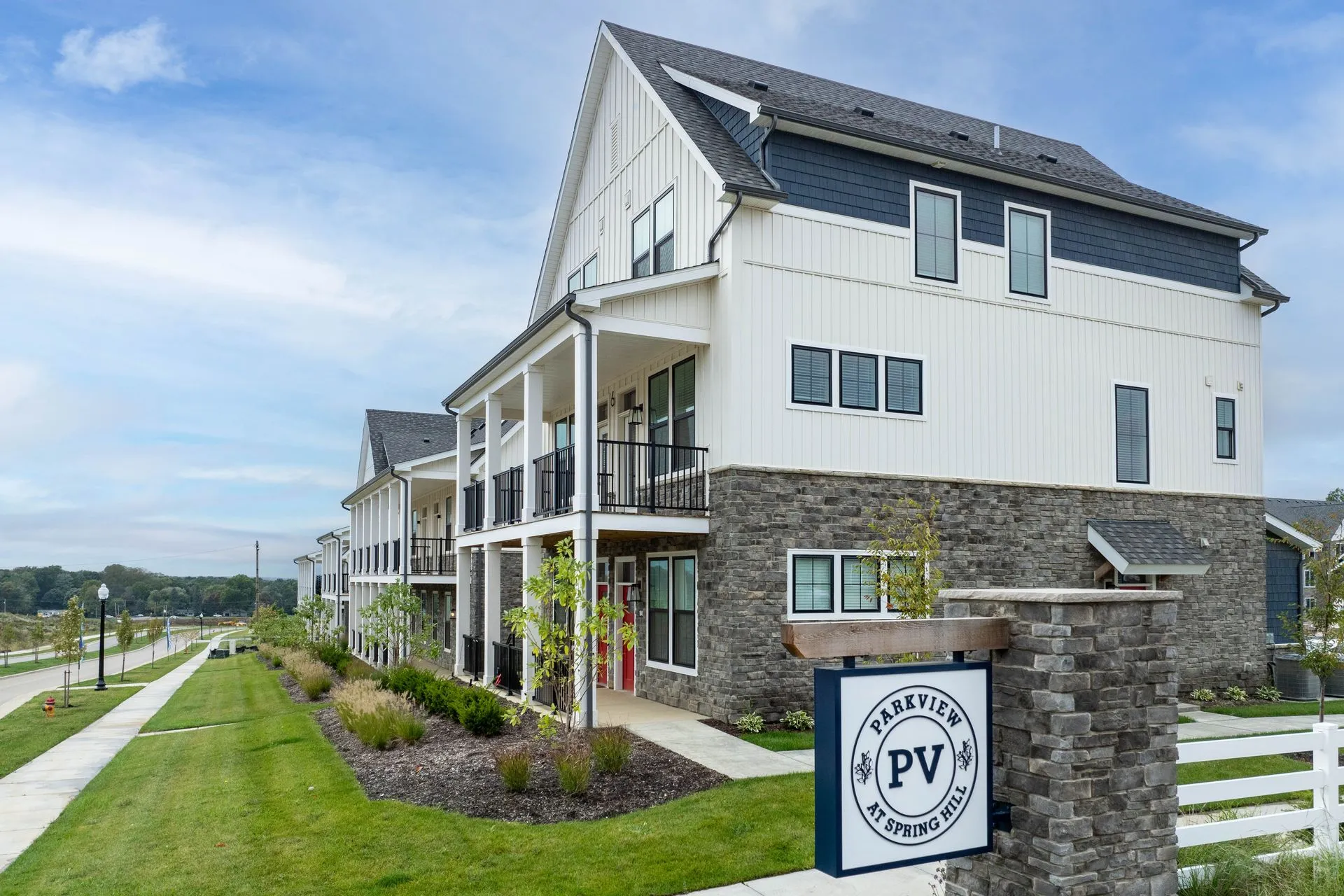 Exterior view of Parkview Apartments showcasing a modern multi-family building surrounded by landscaped grounds.