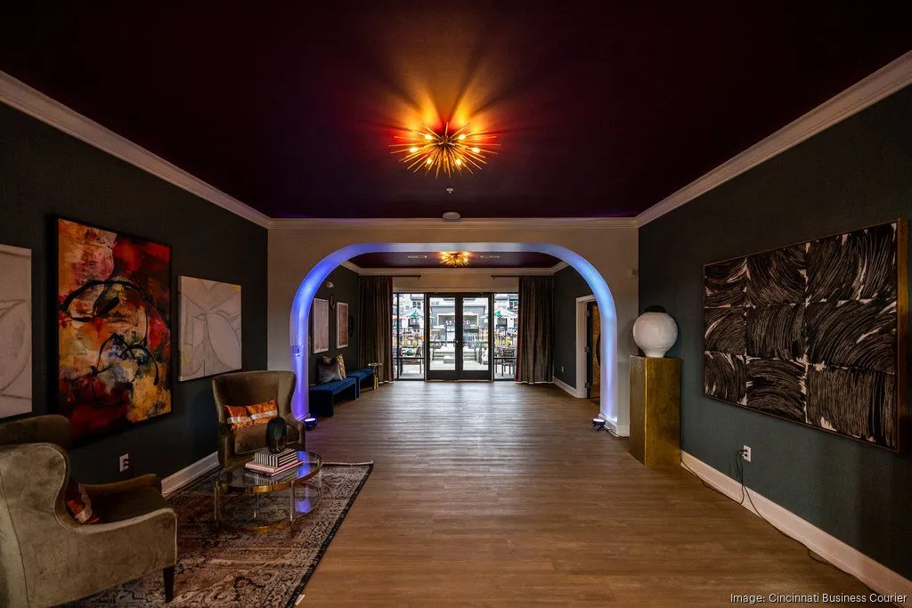 A modern lobby area featuring stylish decor, artwork on the walls, and an inviting atmosphere.