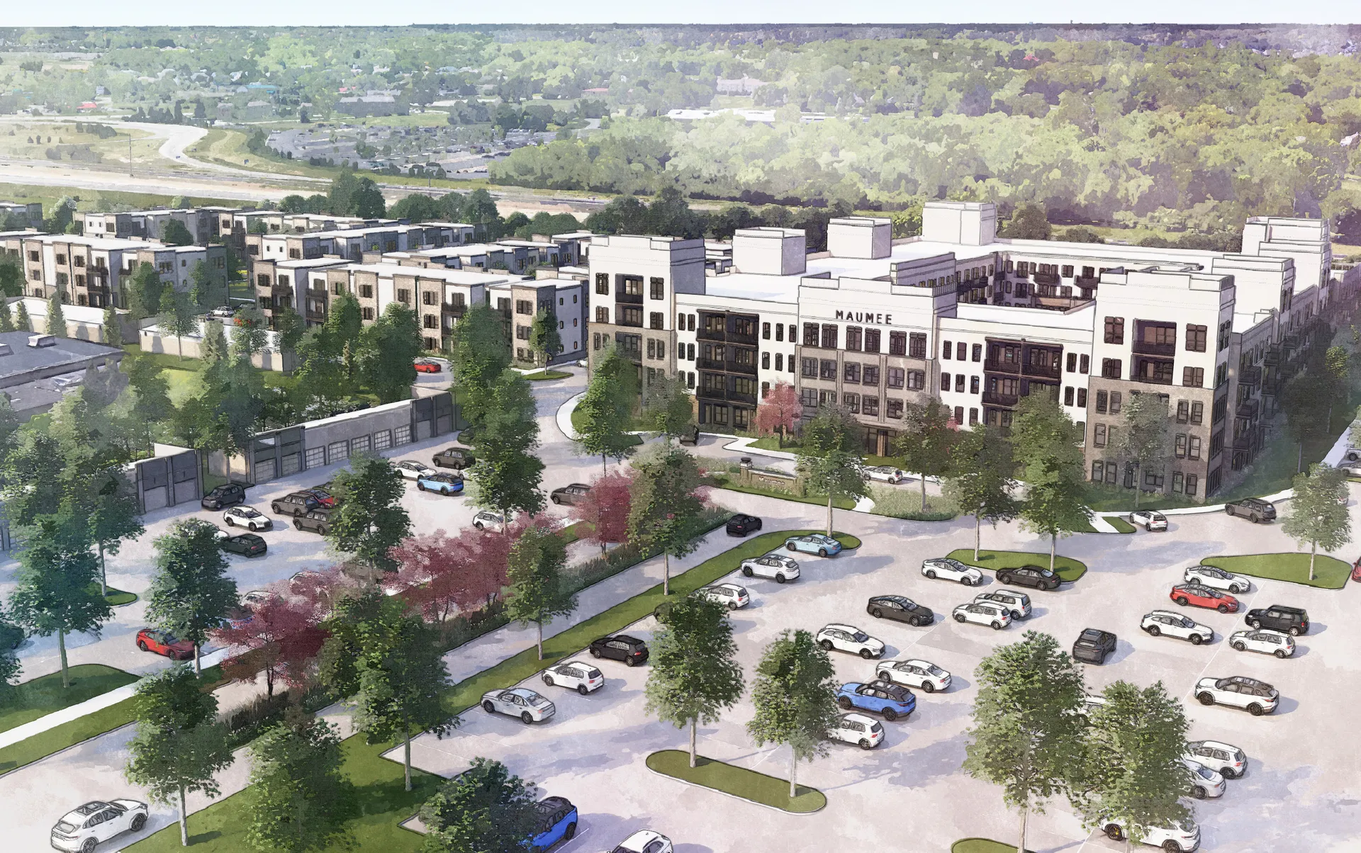 Aerial view of a modern apartment complex with landscaped green areas and parking.