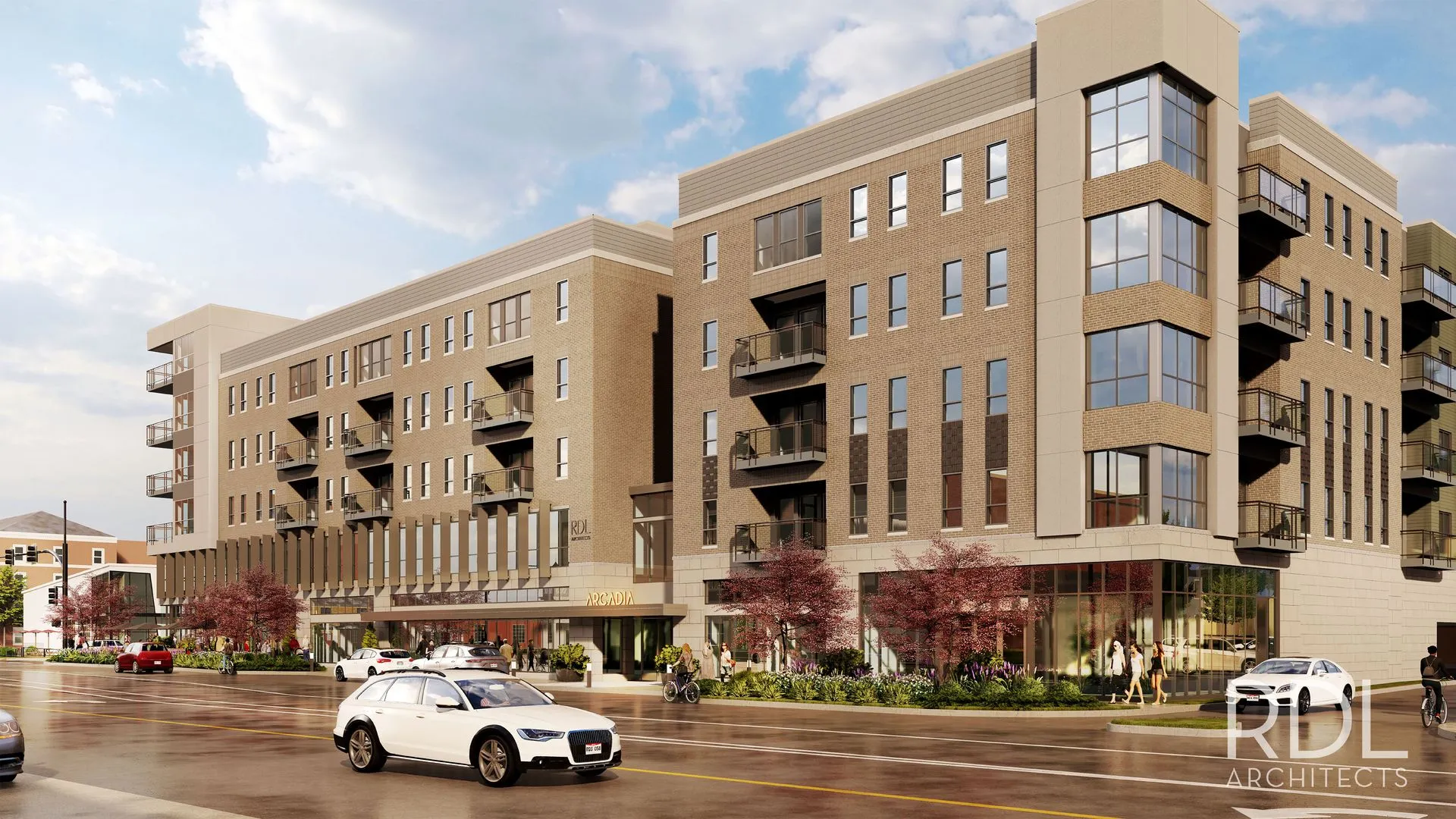 Exterior view of a modern apartment building featuring multiple floors, balconies, and landscaping.