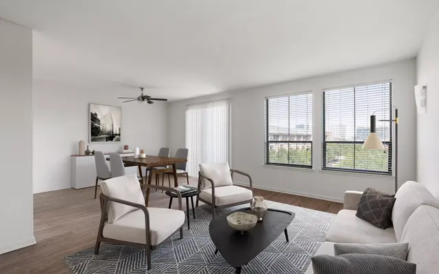 An open-concept living room and dining nook in Legacy North, Plano apartments for rent.