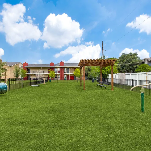 Dog park at North Star Apartments with obstacle course in Dallas, TX