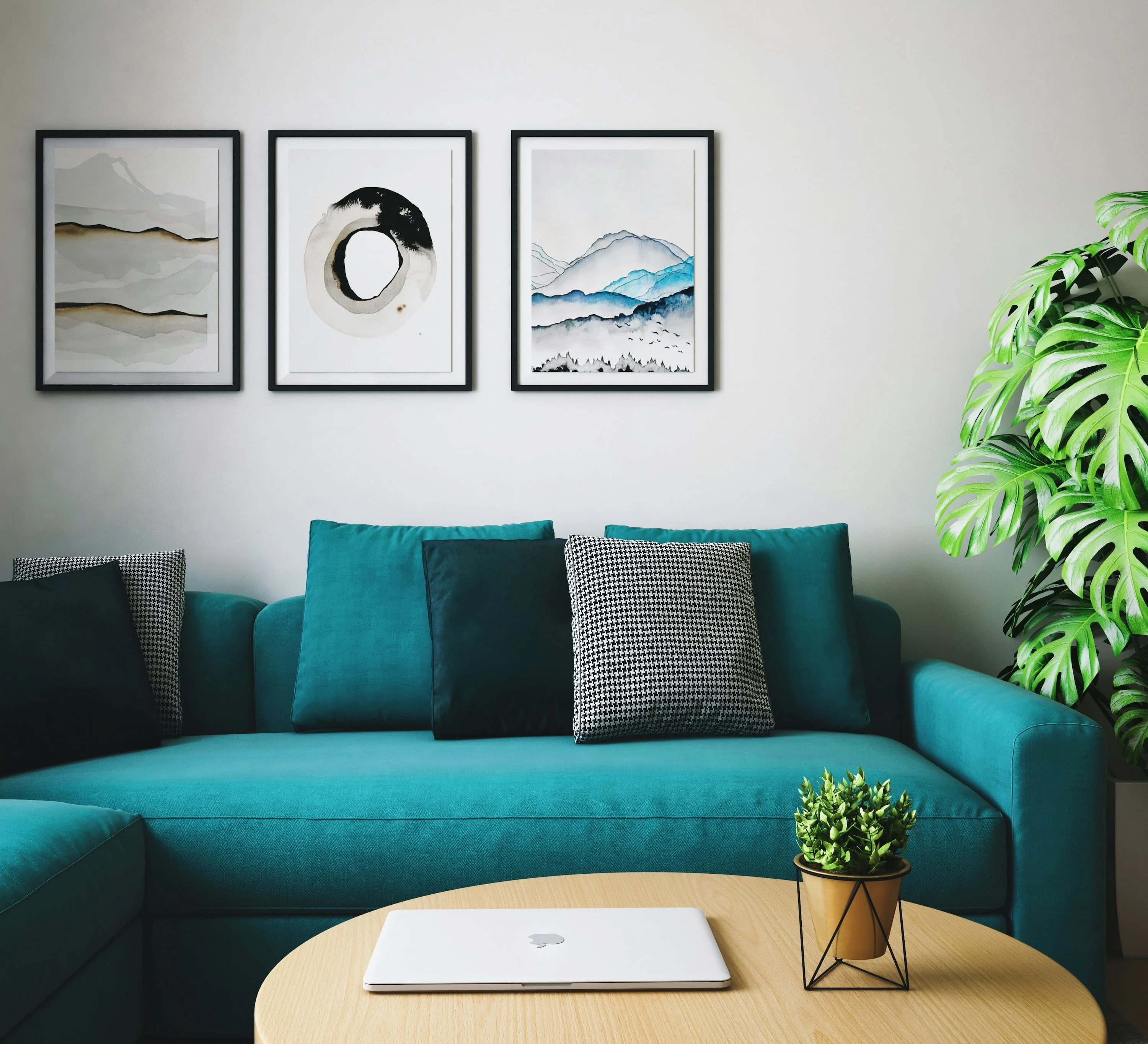 Seaport Village Living area with teal couch and wood coffee table