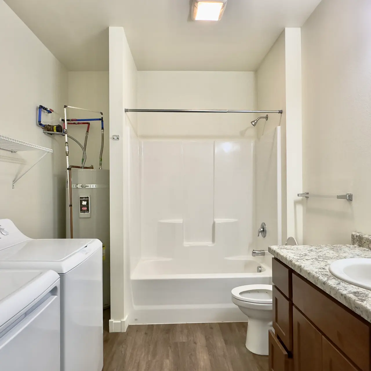 apartment bath room Undecorated bathroom in an apartment, featuring basic fixtures and clean design