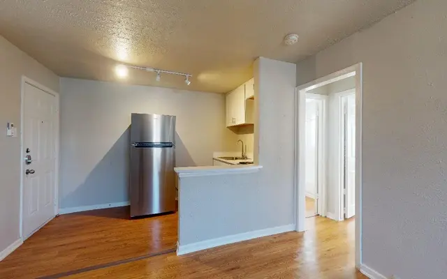 Caracara Apartments - Flooring, Floor, Wood, Kitchen, Wall