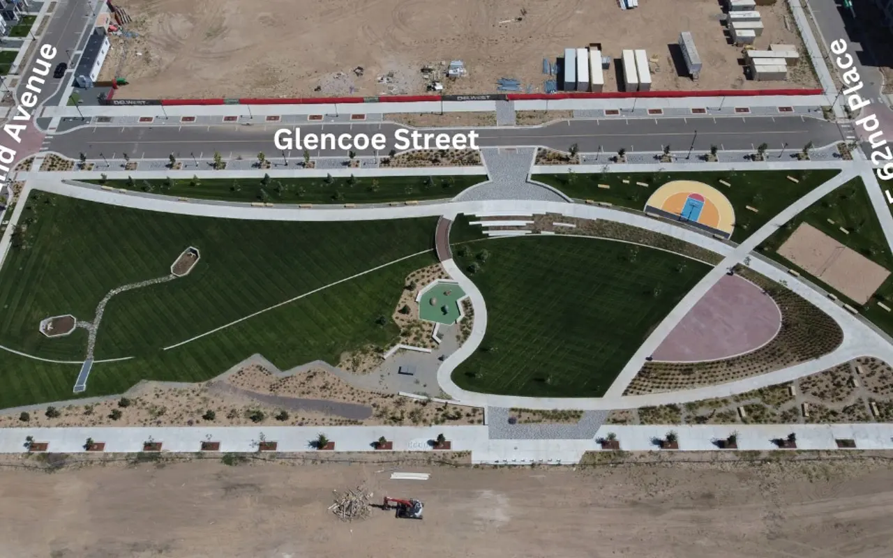 Aerial view of a park layout with green lawns, walking paths, and sports courts, labeled with street names: Glencoe Street, E 62nd Avenue, E 62nd Place.