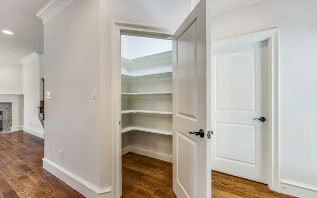 Modern Pantry Interior Interior view of a pantry room with open door and wooden floors