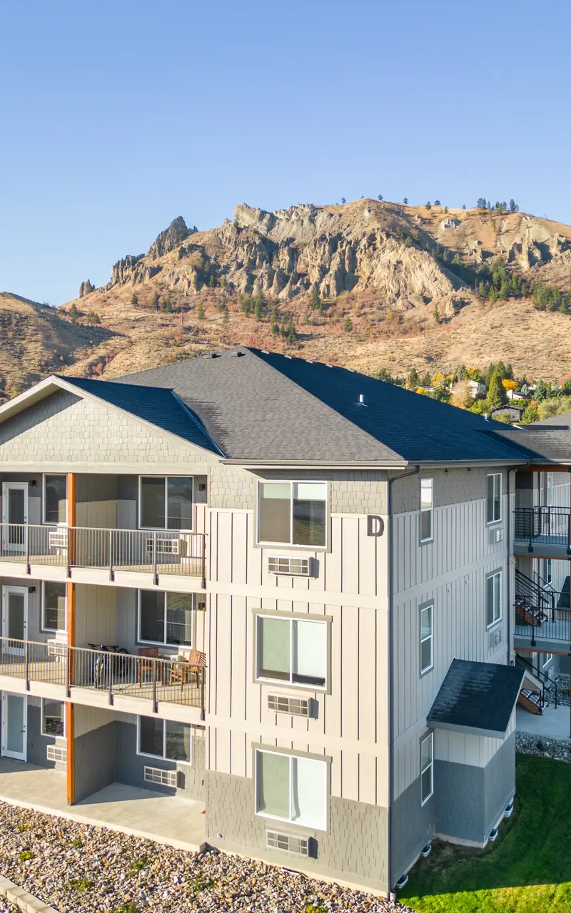 Scenic balcony with expansive views, featuring comfortable seating and surrounded by natural landscapes, offering a tranquil outdoor escape