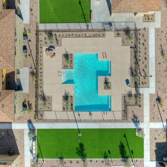 Aerial View of Community Pool Aerial view of a community pool surrounded by landscaped areas and apartment buildings.