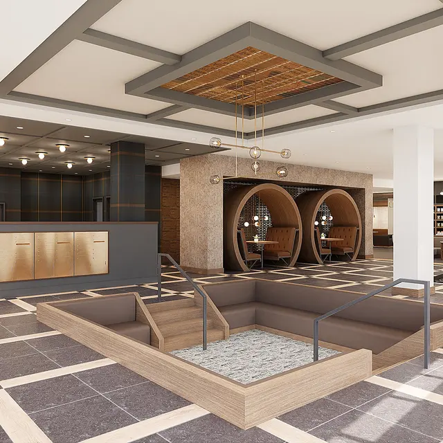 Interior view of a modern hotel lobby featuring a reception desk, circular seating areas, and stylish decor