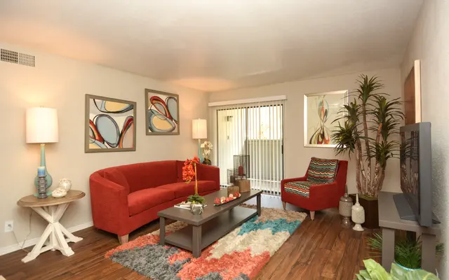 Lost Creek Ranch Apartments Lost Creek Ranch Apartments - Living Room, Chair, Table