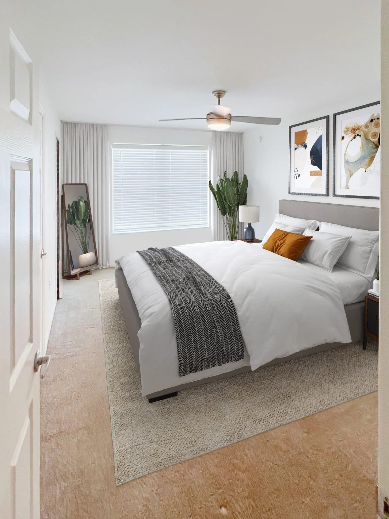 4712_100 Laurel Cir, Bartow, FL 33830_BR_Draft_02 (1).jpg Modern bedroom with a large bed, white bedding, a ceiling fan, artwork on the walls, and a potted plant by the window.