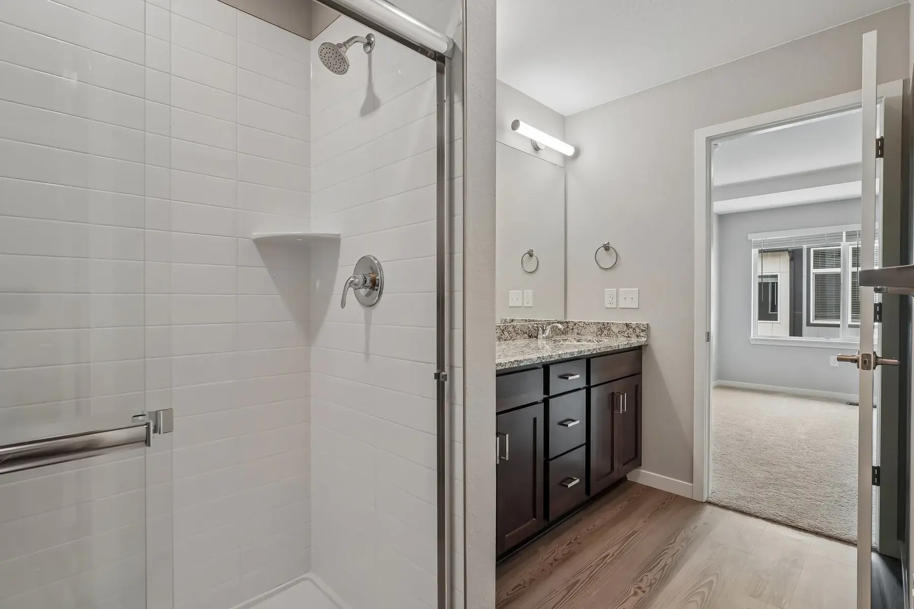 Modern Bathroom Interior Interior view of a modern bathroom featuring a glass shower and vanity with sink.