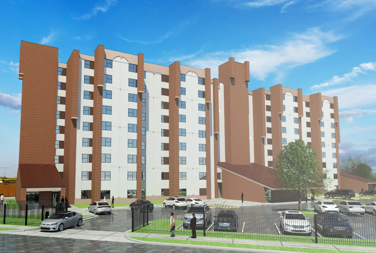 Contemporary Apartment Building A modern six-story apartment building showcasing a combination of white and brown brick exterior. The building has large windows, a few trees, and a parking area filled with cars. Clear blue sky is visible in the background.