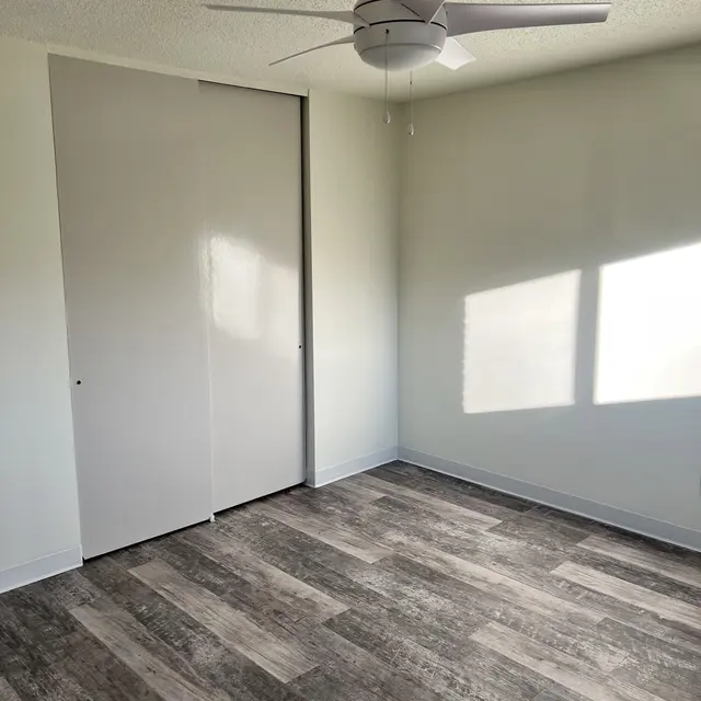 Room with beautiful wood flooring, showcasing a rich, warm finish and natural grain patterns that add a touch of elegance and warmth