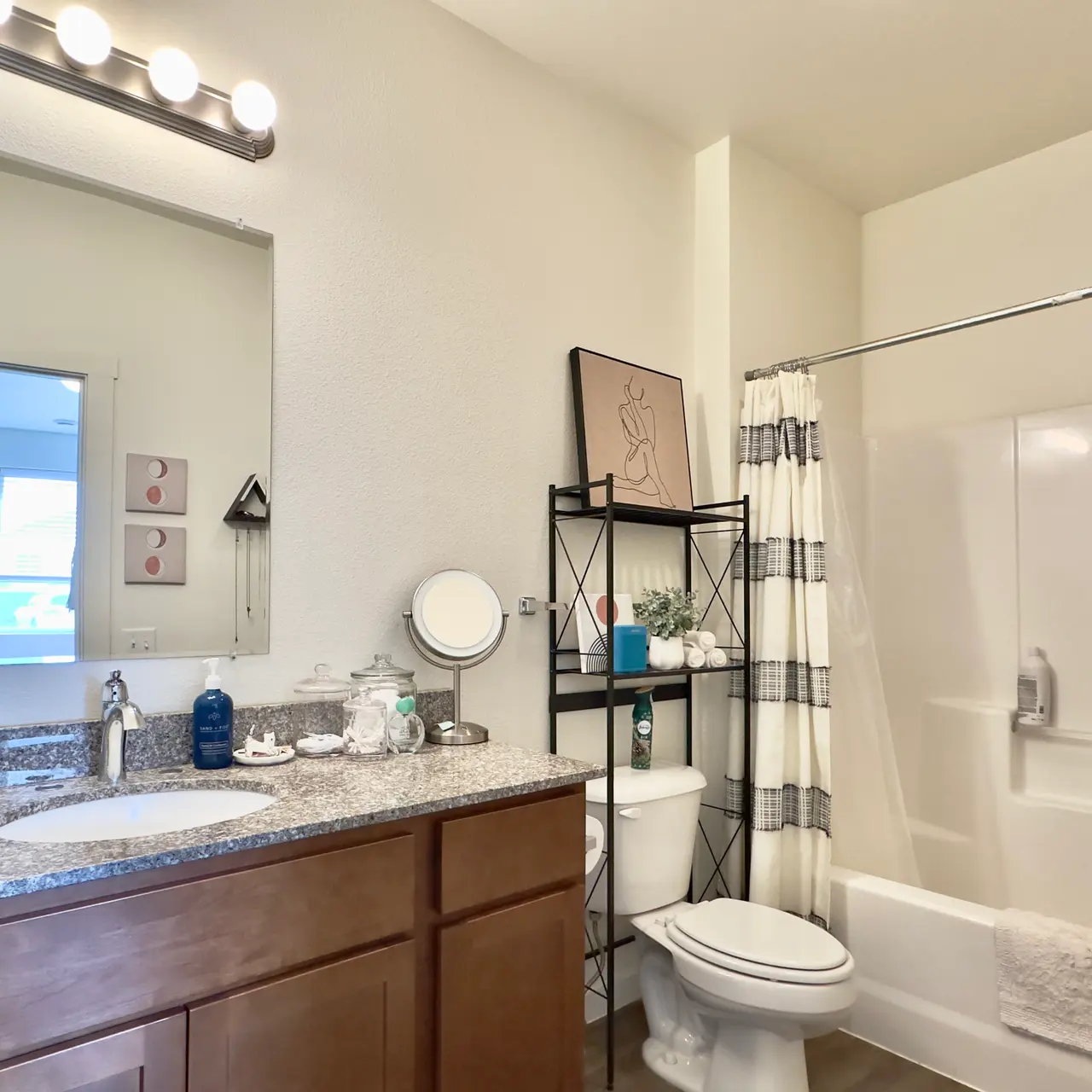 apartment bath room Decorated bathroom in an apartment, showcasing modern fixtures and tasteful design elements