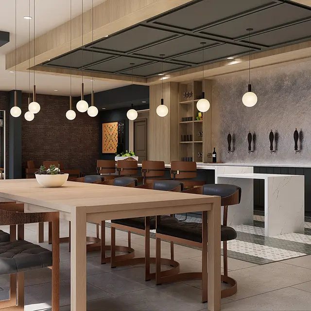 Modern Dining Area Design A spacious modern dining area with a long wooden table surrounded by high-backed chairs, pendant lighting hanging above, and a stylish kitchen space in the background.