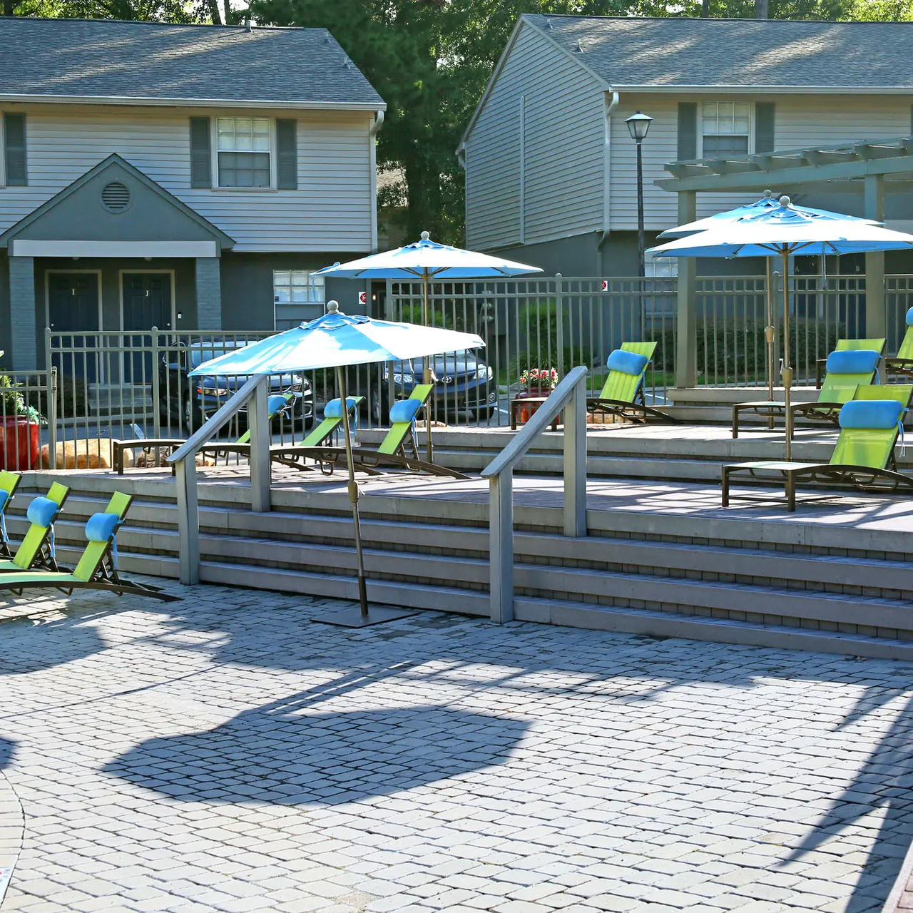 multi level pool deck with lounge chairs
