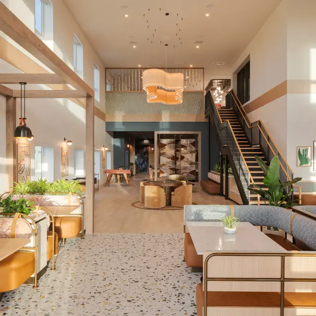 A modern interior design featuring a spacious lounge area with natural light and plants.