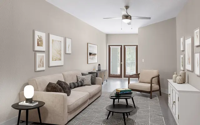 Interior of Vera Apartments in Jacksonville FL - Corner, Home Decor, Coffee Table in living room with couch and chairs
