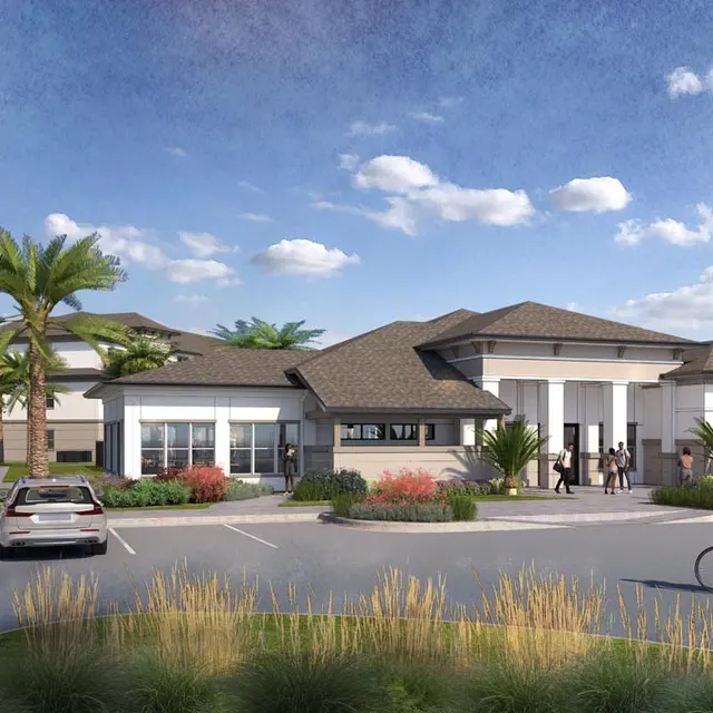 A modern building exterior with a contemporary design, featuring large windows, a pitched roof, and surrounded by palm trees. People are seen walking and a cyclist is riding by, showcasing a vibrant community atmosphere. The scene is set under a partly cloudy blue sky with landscaping visible in front.