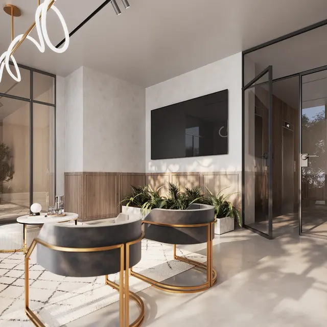 A modern living room featuring two stylish chairs and a sofa, with glass walls allowing natural light. A television is mounted on the wall, and plants are placed around the space.