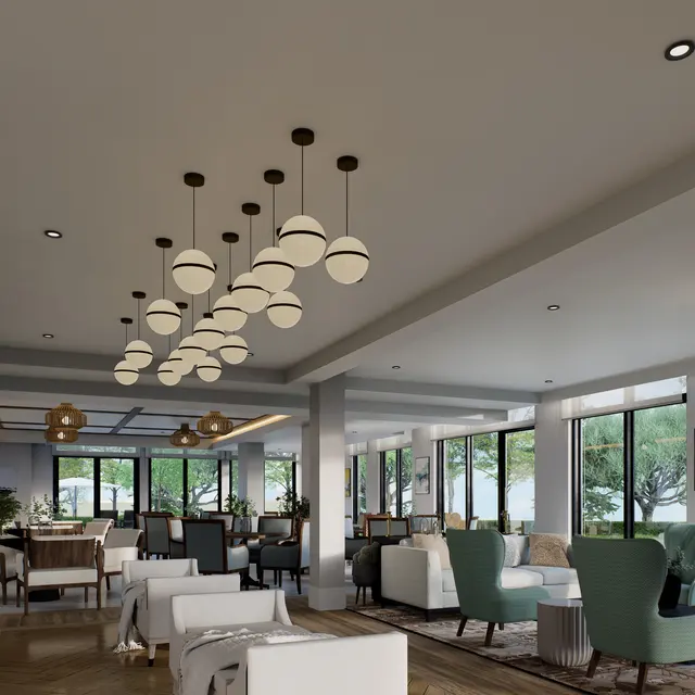 A modern lounge area with stylish furniture, including white and green chairs, a wooden floor, and large windows letting in natural light.