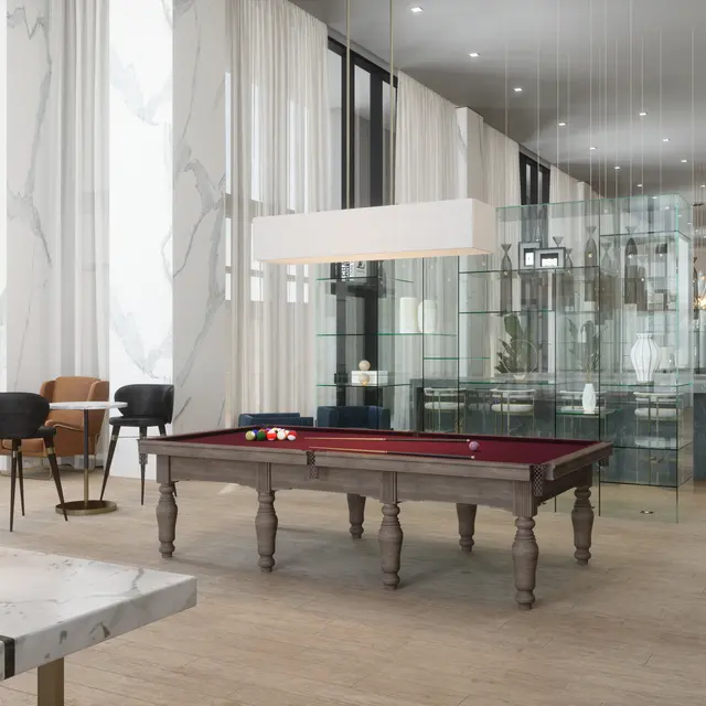 A spacious lounge area featuring a pool table, seating, large windows with light curtains, and modern decor.