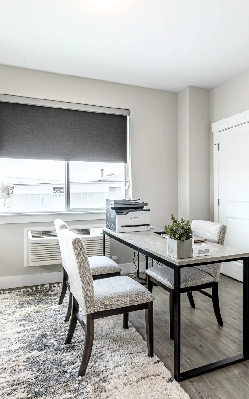 Primary bedroom in a furnished apartment, showcasing stylish decor and comfortable furnishings