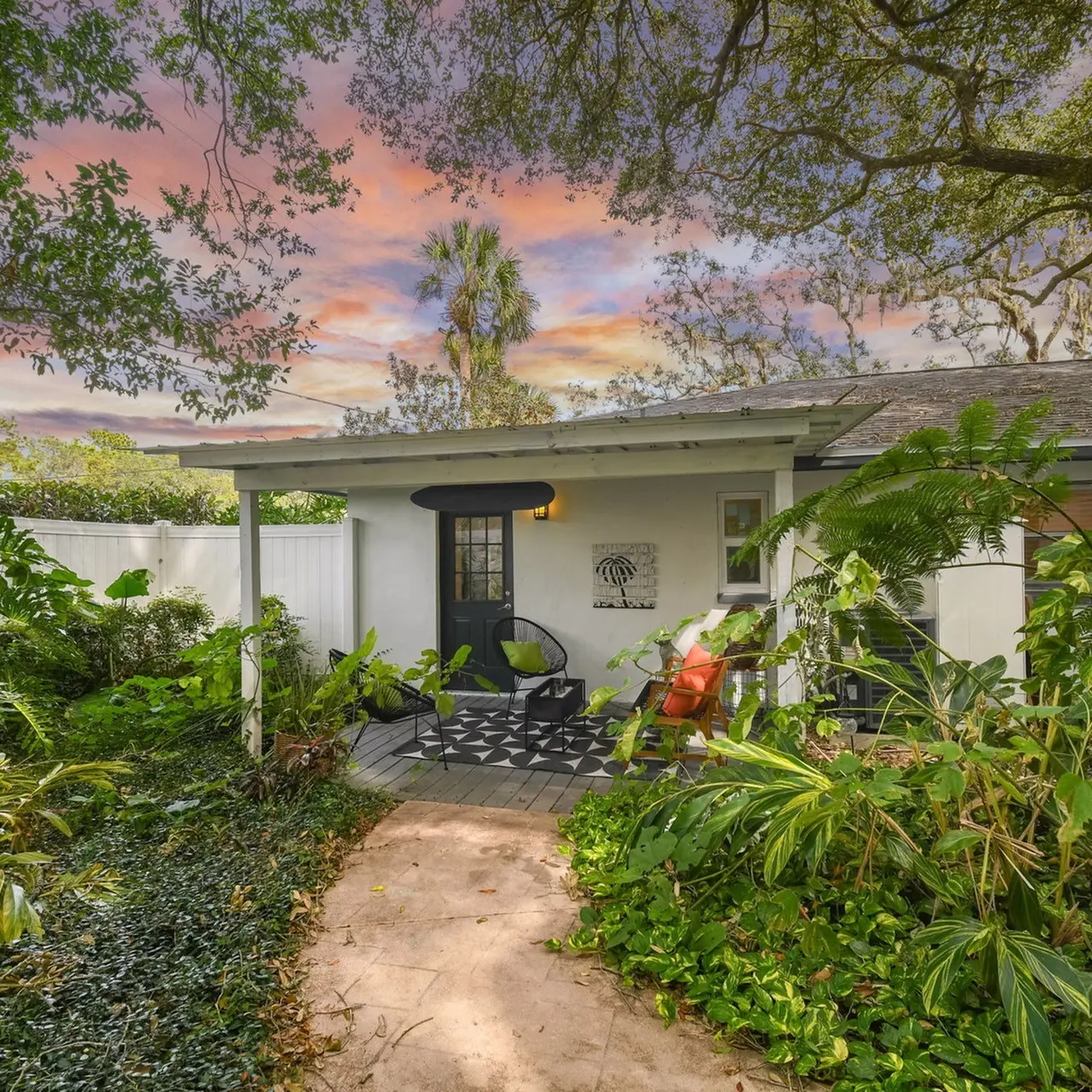 The exterior area of an apartment in our community, fitted with a garden, and a paved walkway