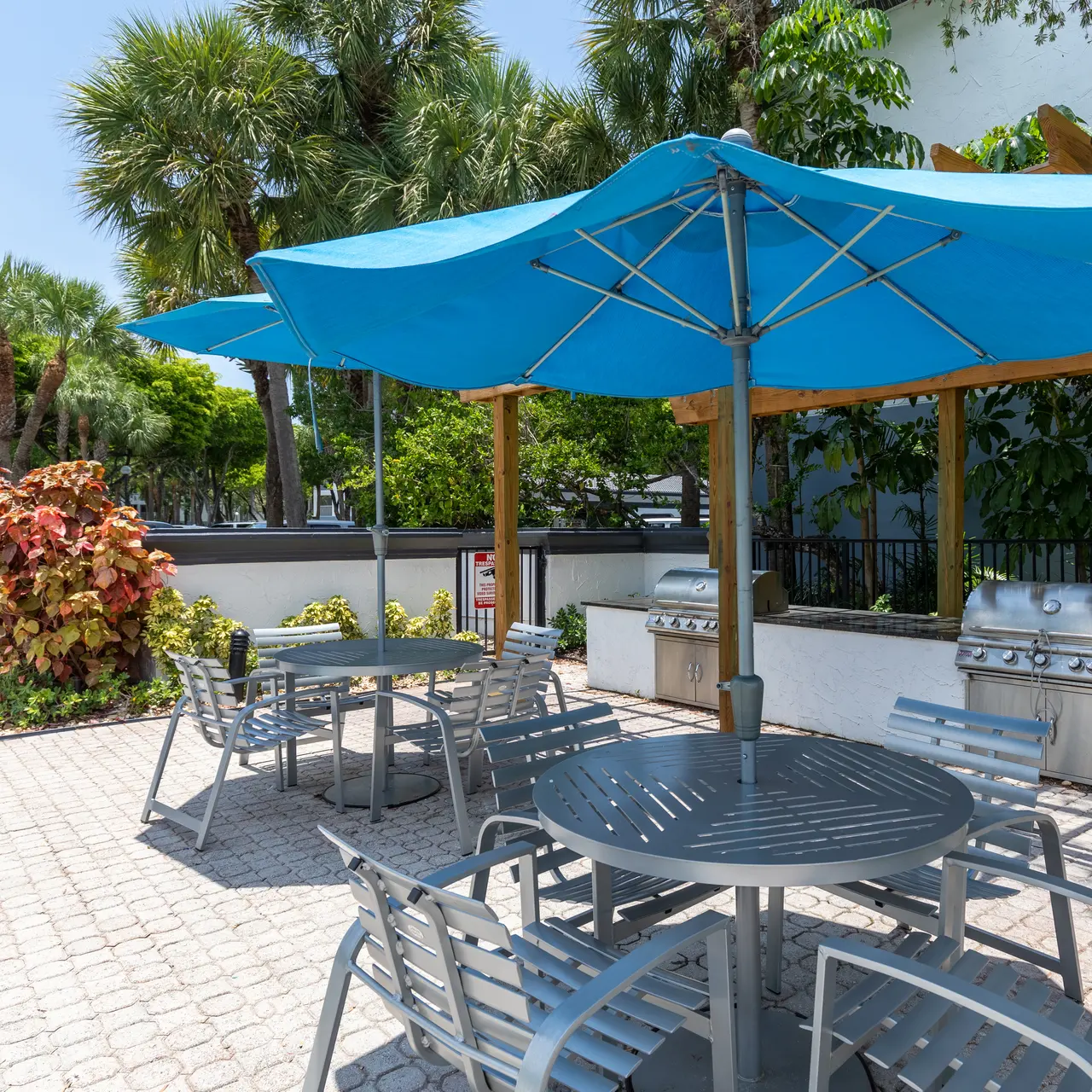 grill and seating area on the pool deck