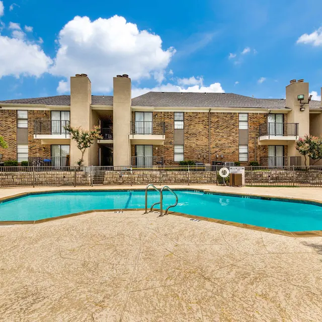 Resident pool with covered seating area and North Star apartments in the background