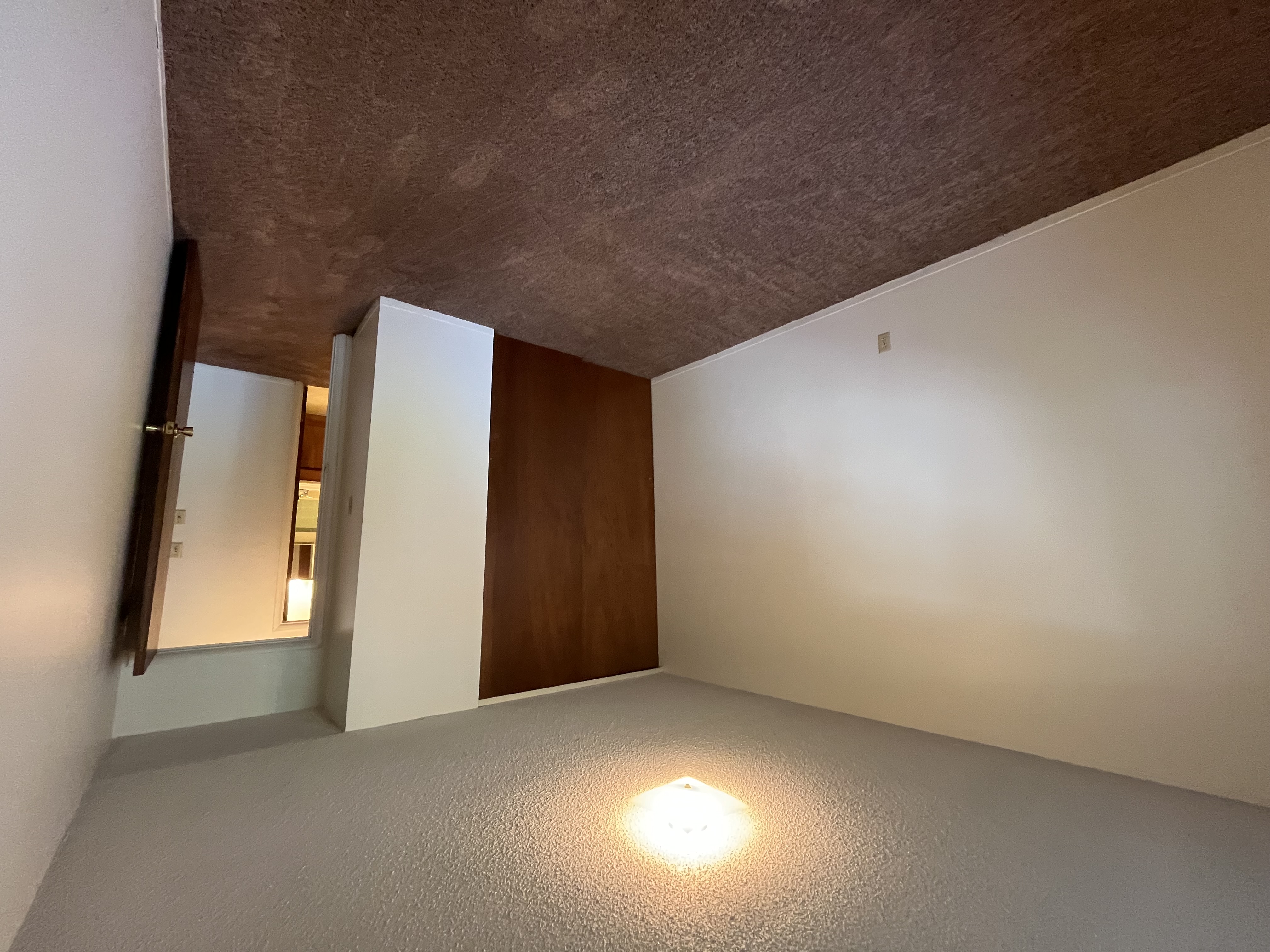 apartment bedroom in an unfurnished apartment, showcasing clean, spacious design. 