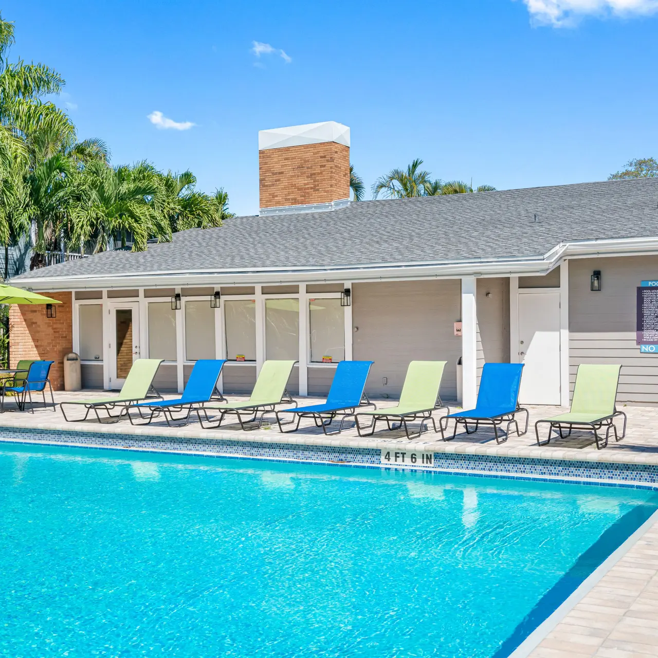 shimmering pool with lounge chairs