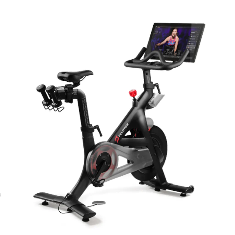 High-Tech Indoor Cycling Bike An indoor cycling bike featuring a large display screen at the front, handlebars with grips, and a comfortable seat, designed for fitness workouts.