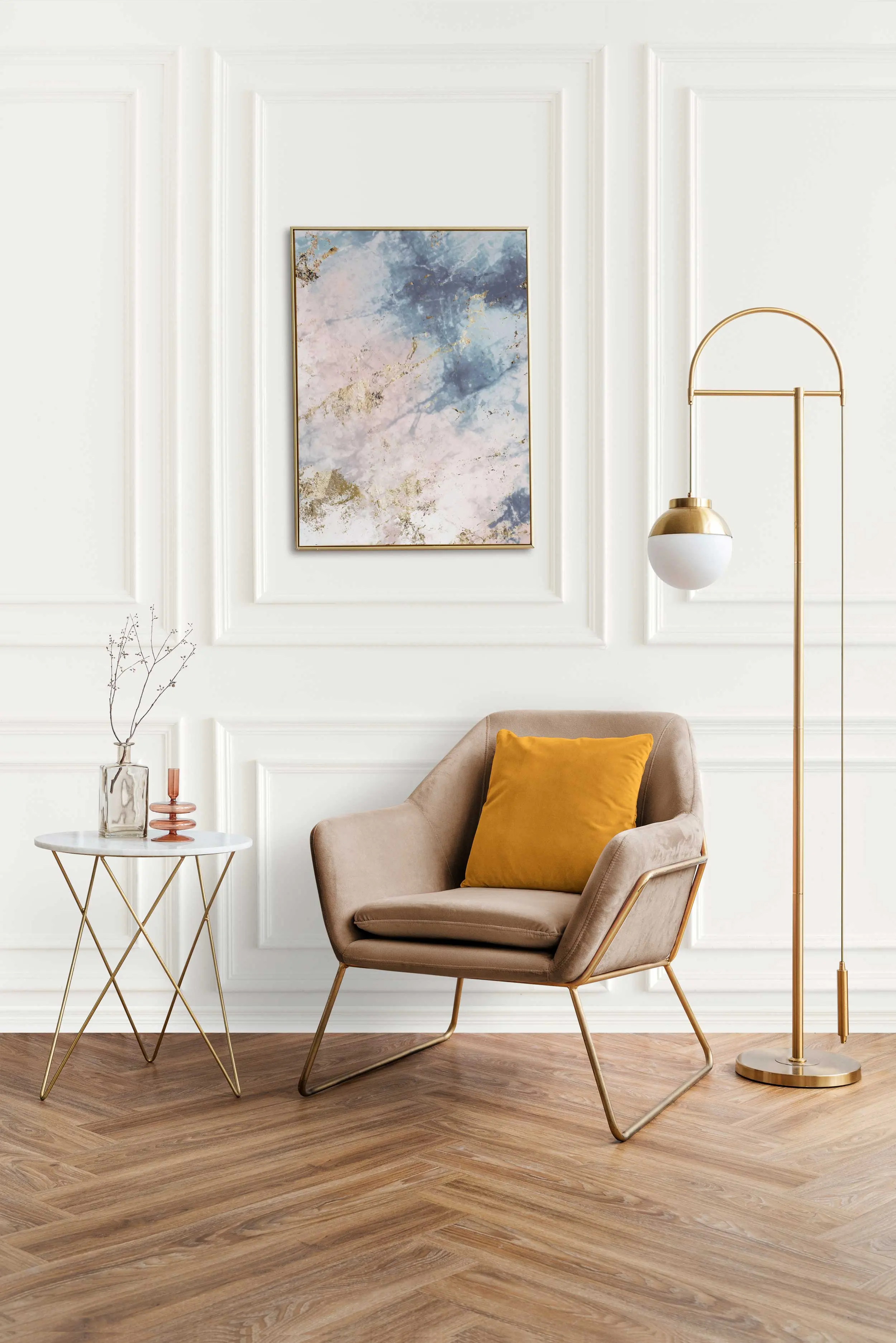 Modern Living Room Design A cozy modern living room featuring a beige armchair with a yellow cushion, a small round side table with decorative items, and an elegant floor lamp. The walls are white with a decorative panel, and a colorful abstract painting hangs above the armchair.