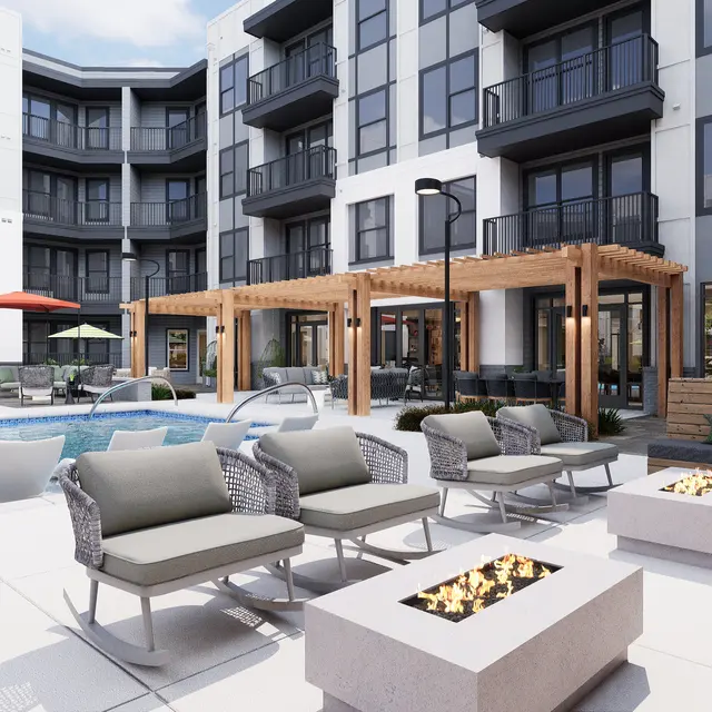 A modern apartment complex pool area featuring lounging chairs, fire pits, and a wooden pergola.