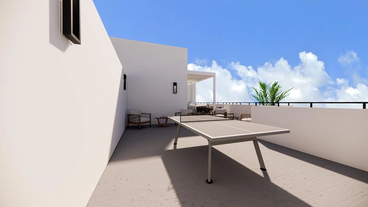 Balcony or terrace area featuring a table tennis table with seating arrangements in the background and blue skies with white clouds above.