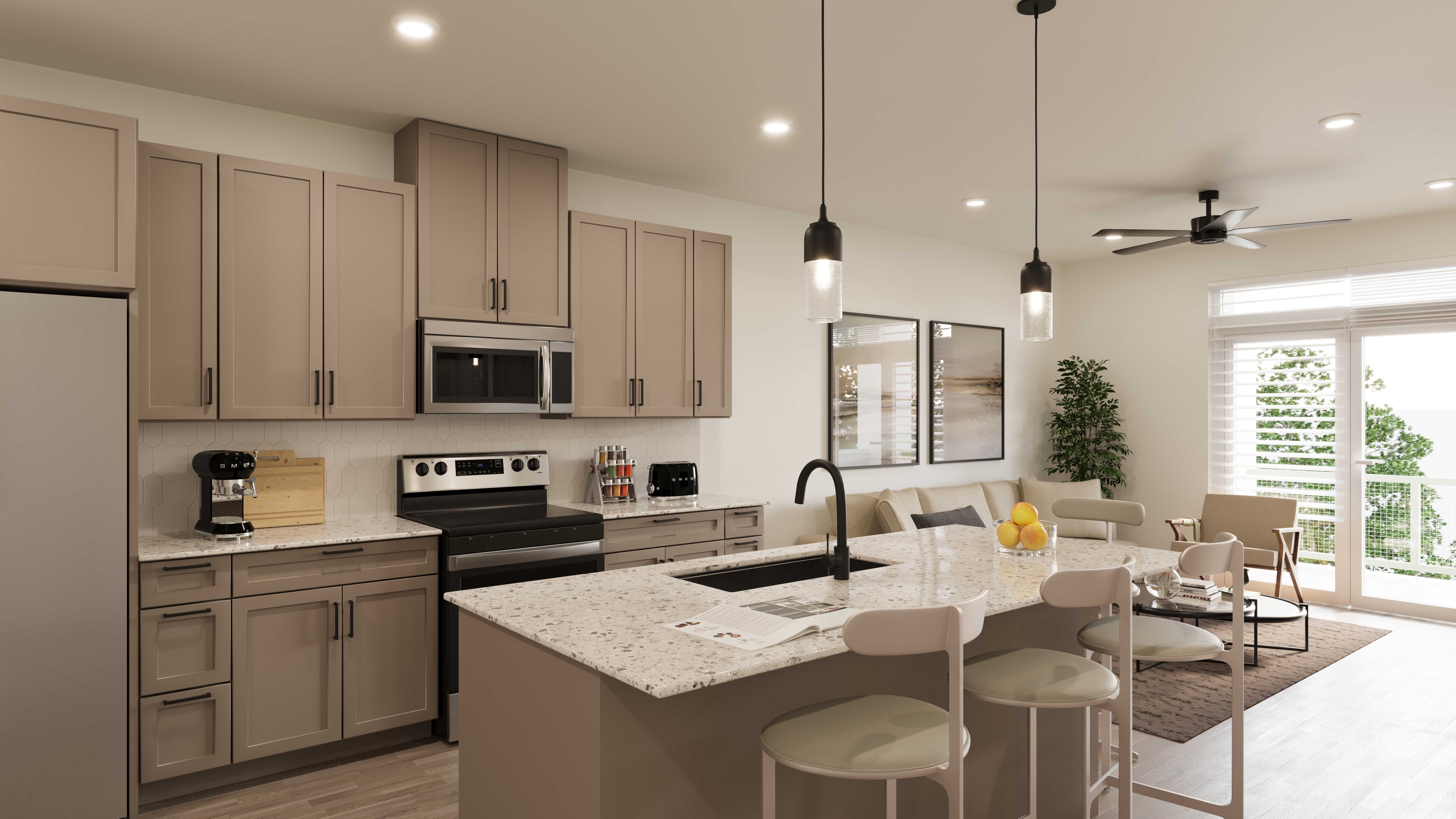A modern kitchen featuring light brown cabinets, stainless steel appliances, and a large island with seating. The adjacent dining area has a beige sofa and a round table. Bright natural light enters through large windows.