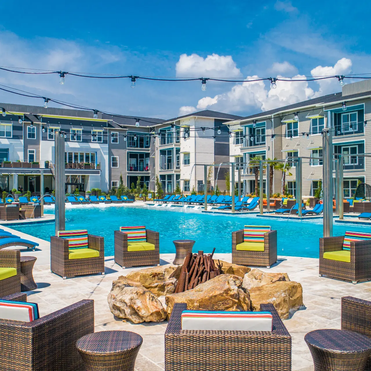 Poolside Fire Pit - The Pointe North Hills Photo of poolside fire pit and lounge chairs at The Pointe North Hills.