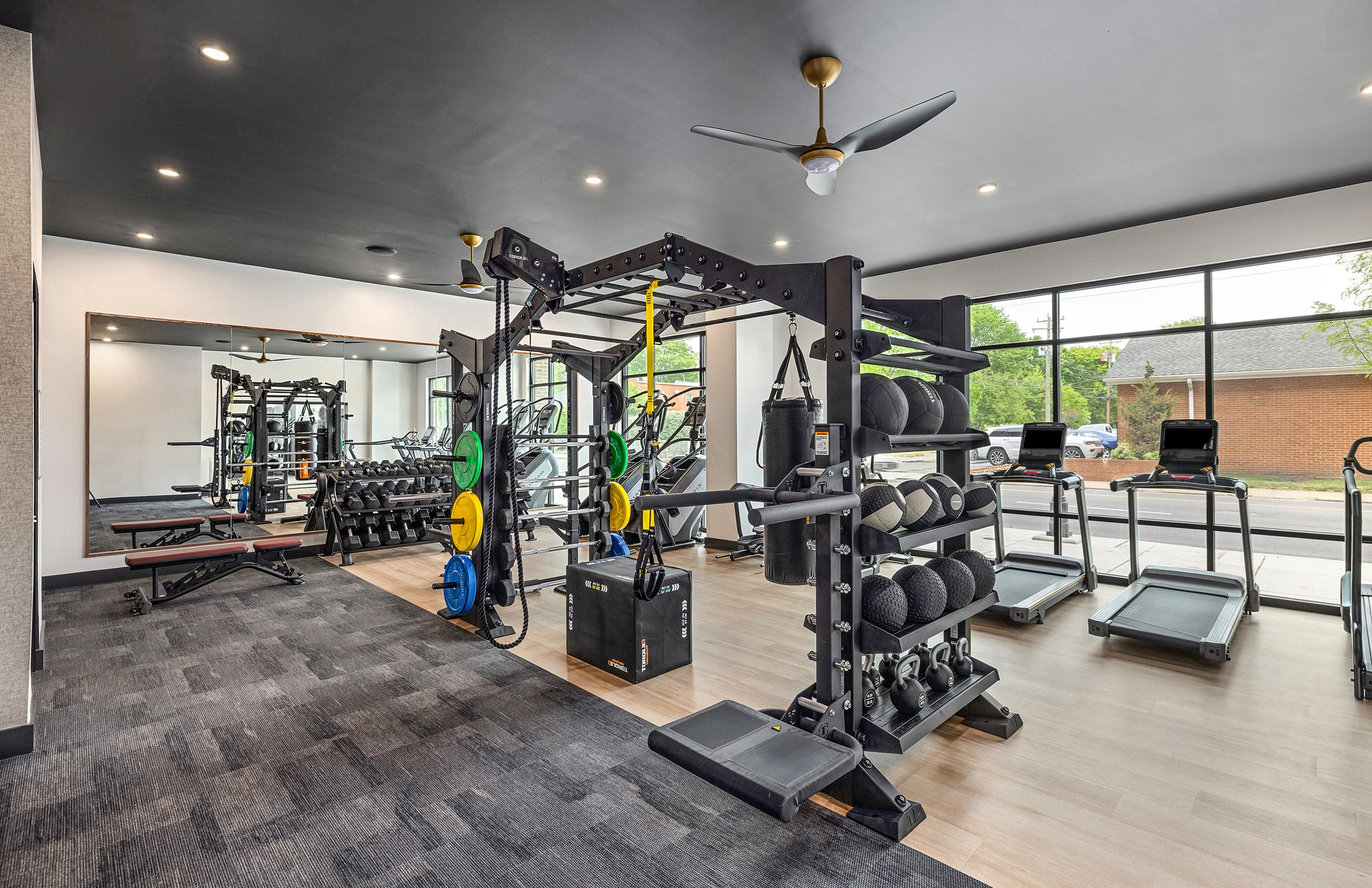 Modern Gym Interior Interior of a modern gym featuring workout equipment and large windows.