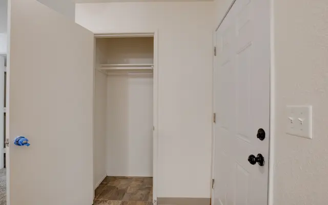 View of an interior entryway featuring a closet and a front door