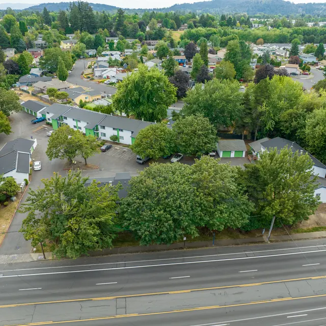 Aerial View of Residential Neighborhood Aerial view of a residential area with green trees and buildings