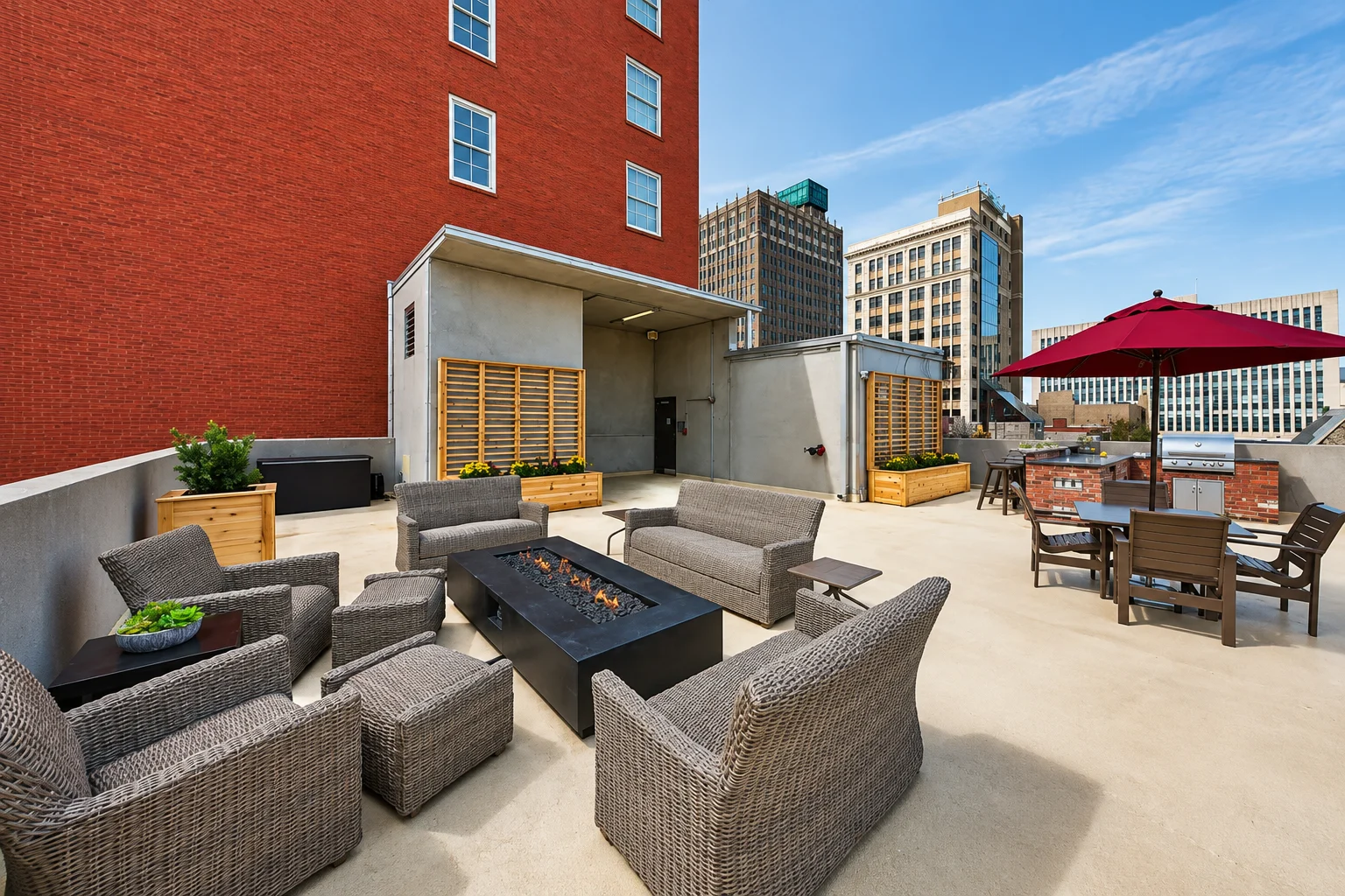 Rooftop communal space featuring seating areas and a fire pit.