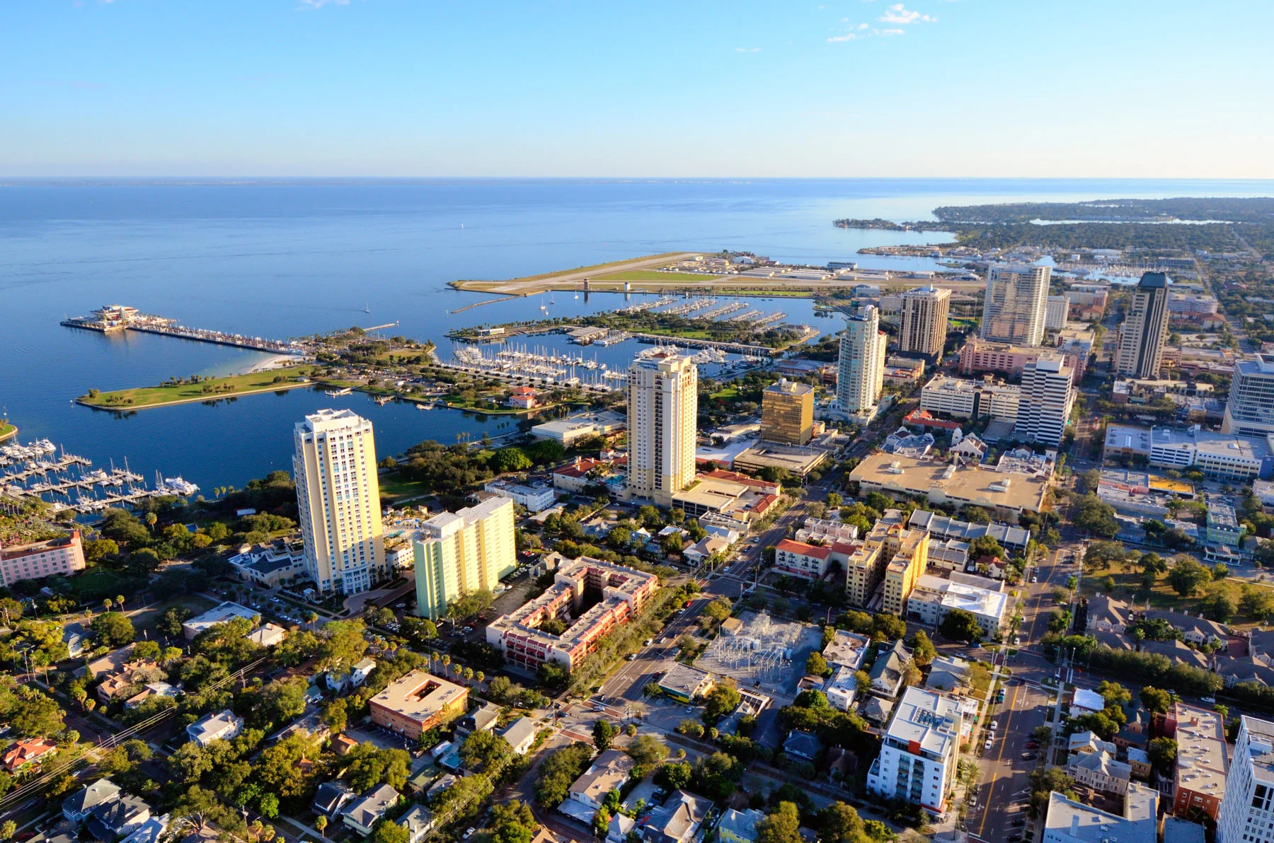 Aerial Urban Coastal Landscape Aerial view of a coastal city with a marina and tall buildings