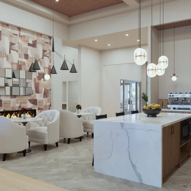 A modern kitchen and living area featuring a marble island, white chairs, a decorative wall, and pendant lights.