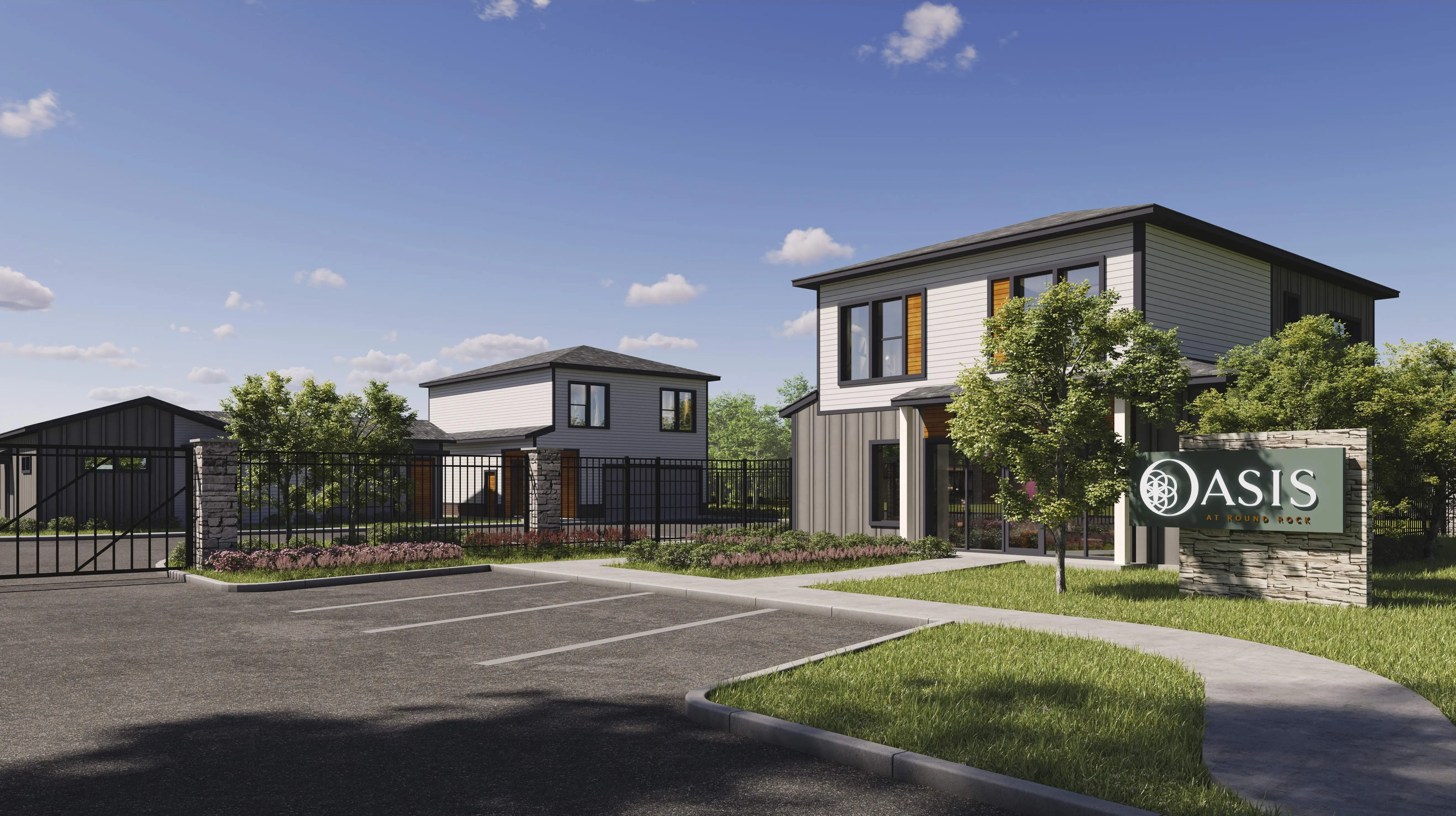 A modern residential property featuring two buildings, lush greenery, and a welcoming sign that reads 'Oasis'.