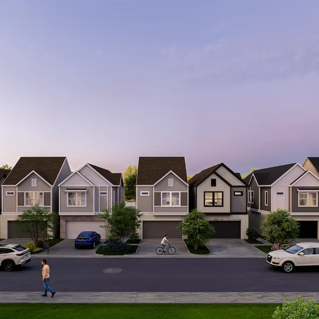 A serene streetscape of a residential neighborhood showcasing modern homes with varying architectural designs. The street features several parked cars, a cyclist, and pedestrians walking, with lush greenery lining the road. The sky transitions from blue to soft purple, indicating dusk.