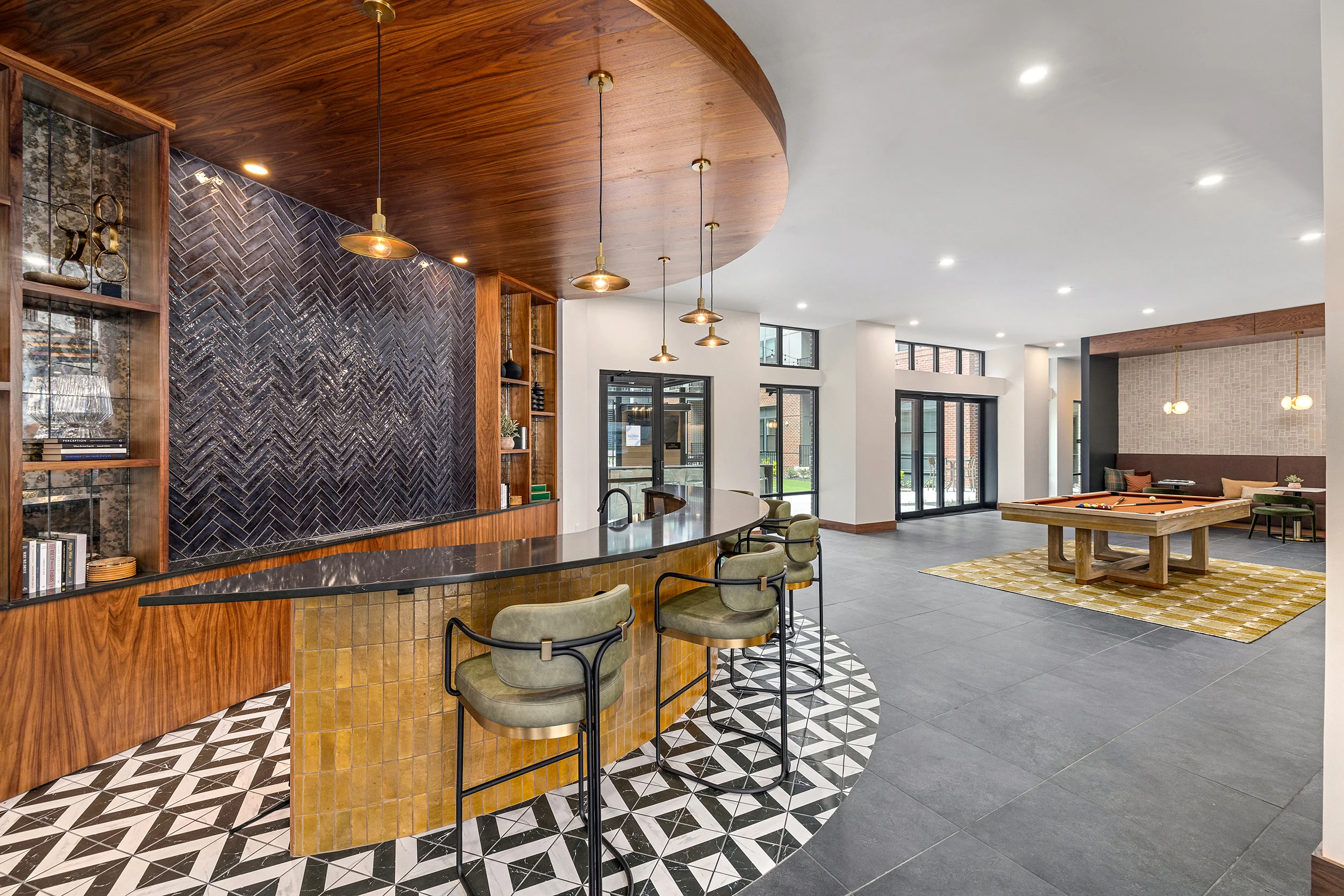 Modern Lobby Interior Design Contemporary lobby space with a round bar, stylish seating, and patterned flooring.