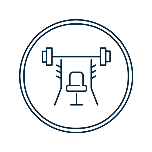 An illustration of a weight bench with a barbell above it, enclosed in a circular border.